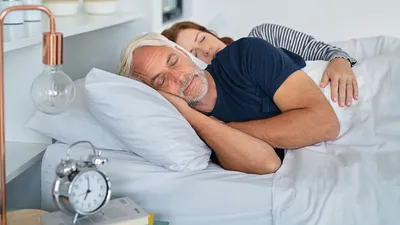 Man resting on bed